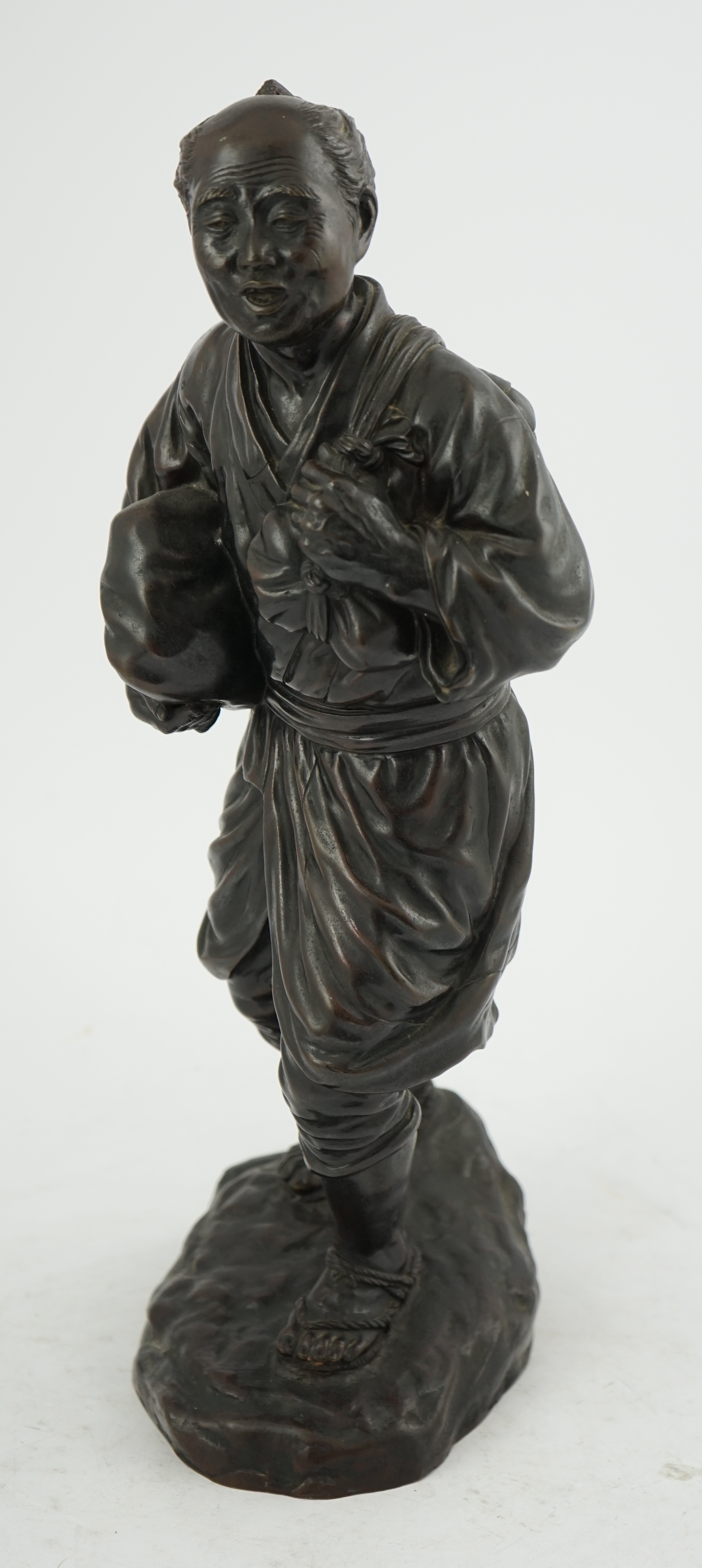 A Japanese bronze figure of a man, 19th century